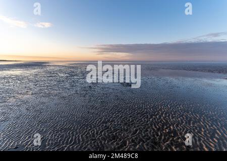 Mer des Wadden à Cuxhaven, Allemagne au coucher du soleil Banque D'Images