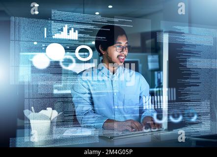 Il sait ce qu'il fait. un jeune programmeur concentré travaillant sur son ordinateur dans le bureau pendant la nuit. Banque D'Images