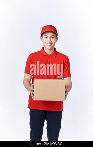 Portrait of a handsome young man holding card cases, isolated on white Banque D'Images
