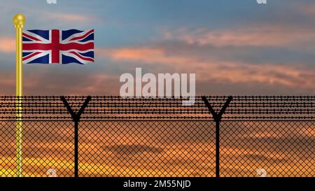 Drapeau du Royaume-Uni agitant sur la frontière de défense à l'heure du coucher du soleil image d'illustration. Banque D'Images
