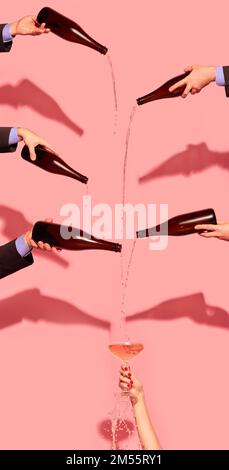 Mains humaines versant du champagne sur un verre sur fond rose. Célébration de la Saint-Valentin Banque D'Images