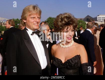 Joan Collins et Peter Holm Circa années 1980 crédit: Ralph Dominguez/MediaPunch Banque D'Images