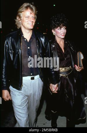 Joan Collins et Peter Holm Circa années 1980 crédit: Ralph Dominguez/MediaPunch Banque D'Images