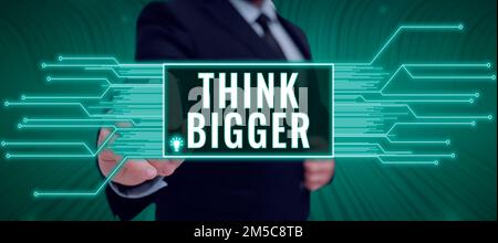 Affiche d'écriture à la main pensez plus grand. Concept, c'est-à-dire être capable de rêver et de visualiser ce que vous pouvez réaliser Banque D'Images