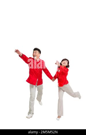 Couples chinois heureux tenue nouvel an Banque D'Images