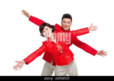 Couples chinois heureux tenue nouvel an Banque D'Images