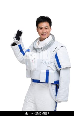 Les astronautes de l'abri affichent un téléphone portable Banque D'Images