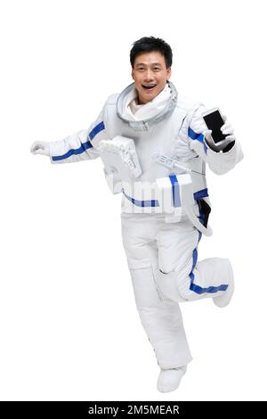 Les astronautes de l'abri affichent un téléphone portable Banque D'Images