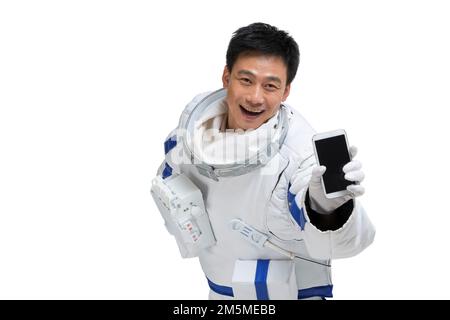 Les astronautes de l'abri affichent un téléphone portable Banque D'Images