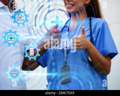 Doigt de pointage gai infirmière médecin scientifique hôpital clinique patient femme homme bon comme oui pouce vers le haut technologie élément graphique conception médecine Banque D'Images
