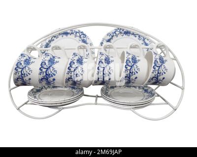 Six placer un jeu de plaques de tasses et de soucoupes sur un rack Banque D'Images