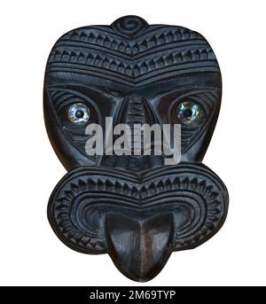 Masque Tiki sculpté en bois maori Banque D'Images