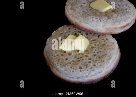 Les crumpets beurrés Banque D'Images