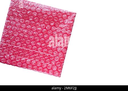 La boîte rouge est enveloppée dans un sac transparent contenant des bulles d'air Banque D'Images