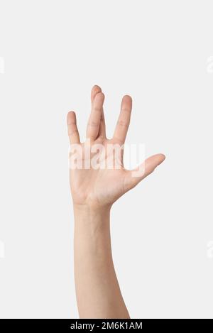 Main de femme avec doigts torsadés. Banque D'Images
