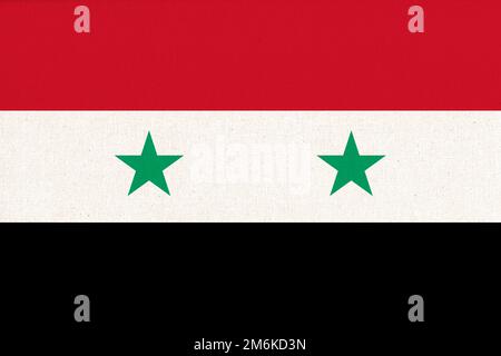 Drapeau de la Syrie. Drapeau syrien sur la texture du tissu. Symbole national de la Syrie Banque D'Images