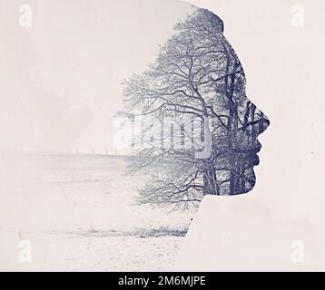 Mère nature. Image d'un paysage d'hiver superposé sur un profil de womans. Banque D'Images