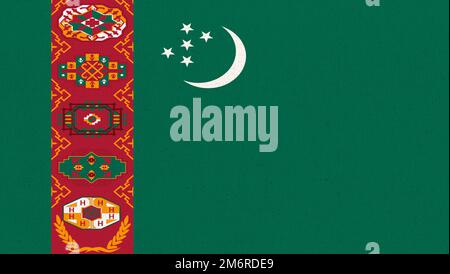 Drapeau du Turkménistan. Drapeau turkmène sur la surface du tissu. Texture du tissu. Symbole national de Turkmenia Banque D'Images