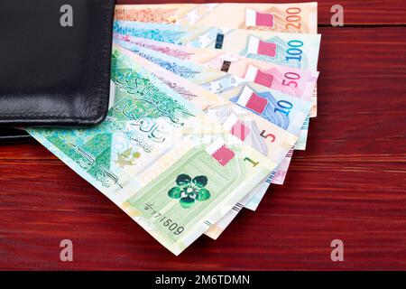Nouvel argent du Qatar dans le portefeuille noir Banque D'Images