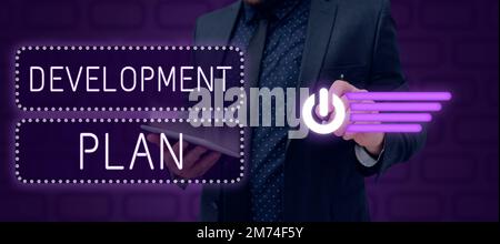 Affiche textuelle indiquant le plan de développement. Idée d'affaires la planification de l'aménagement d'une zone de terre Banque D'Images