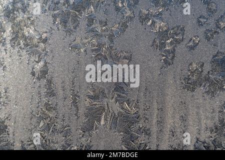 Cadre complet à partir de textures formées par des gouttes congelées sur le verre. Banque D'Images