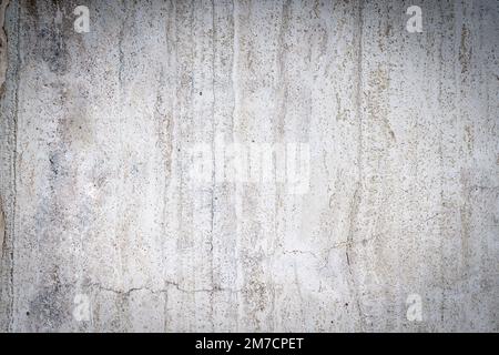 Vieux mur en pierre de béton recouvert de plâtre fissuré et de surface texturée sale. Photo de haute qualité Banque D'Images