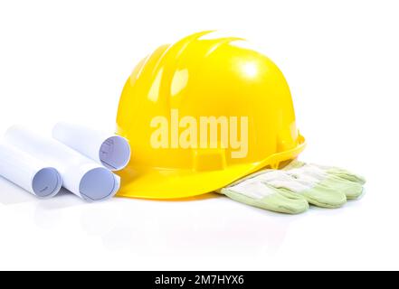 Casque jaune isolé sur la main avec les bleus Banque D'Images