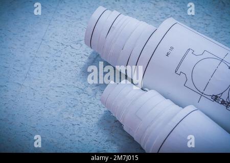 Arrière-plan métallique avec paire de plans roulés concept de construction et d'architecture Banque D'Images