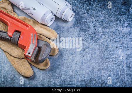 Monkey key key key key blueimprime des gants de protection en cuir sur fond métallique rayé. Banque D'Images
