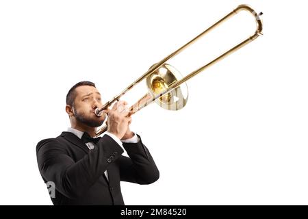 Jeune homme élégant jouant un trombone isolé sur fond blanc Banque D'Images