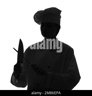 Silhouette de chef féminin avec couteaux sur fond blanc Banque D'Images