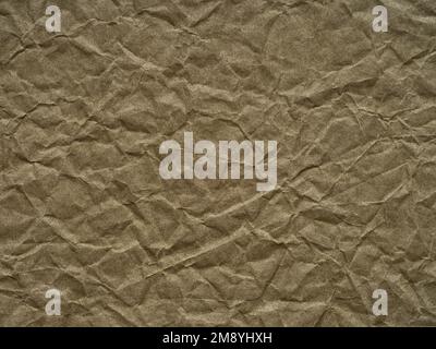 Texture du papier froissé kaki ou olive. Page ou feuille vierge de grunge pour la décoration intérieure et extérieure. Arrière-plan vide pour l'artisanat, Noël Banque D'Images