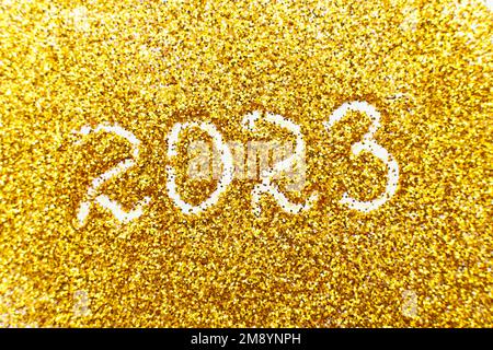 le numéro 2023 écrit sur confetti d'or. arrière-plan de noël ou du nouvel an Banque D'Images