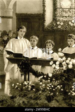 Le matin de Noël, des choirboys chantant dans l'église. Banque D'Images