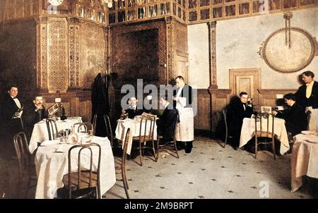 Scène de restaurant de 1910 montrant un dîner avec un téléphone à sa table.