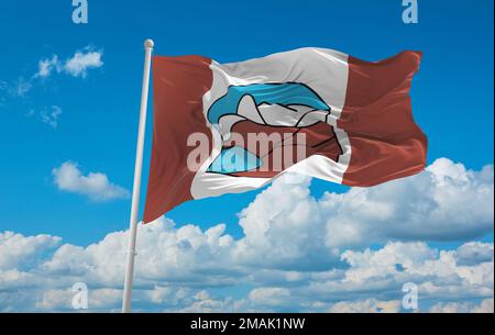 Drapeau officiel de grise Fiord, Nunavut Canada sur fond ciel nuageux au coucher du soleil, vue panoramique. Concept de voyage et de patriote canadien. copier l'espace pour w Banque D'Images