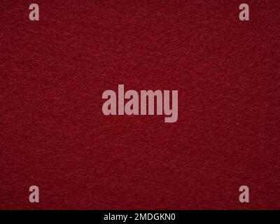 Gros plan sur une texture en feutre blanc rouge foncé. Plein format rétro, motif vintage. Vue de dessus, mise en page, placement pour le texte. Motif en laine texturée pour les magasins de marchandises Banque D'Images