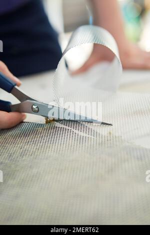 Coupe de micromailles pour une taille supérieure à celle du cadre photo vivant Banque D'Images