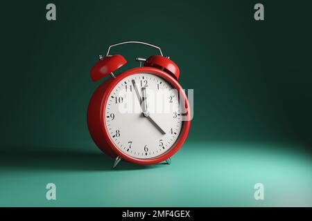 Réveil rouge classique de 2 minutes à 12 heures sur fond vert. Le concept de l'heure, de la date d'échéance, du compte à rebours, du calendrier et de la ponctualité Banque D'Images