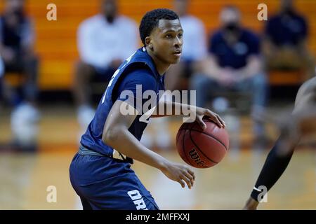 Oral Roberts Guard Max Abmas, Right, Drives Up Court Ahead Of Arkansas ...