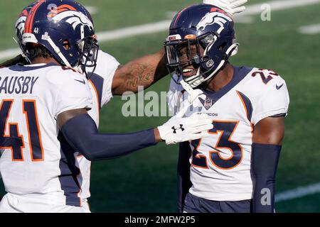 Denver Broncos cornerback Michael Ojemudia (13) and Denver Broncos place  kicker Brandon McManus (8) against the Indianapolis Colts of an NFL  football game Thursday, Oct 6, 2022, in Denver. (AP Photo/Bart Young