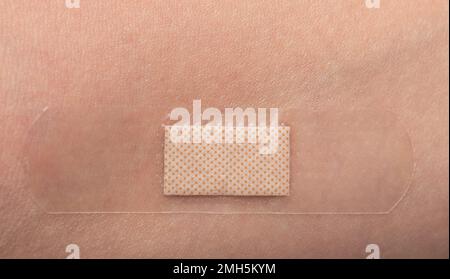 Bande médicale sur la peau cicatrices macro vue rapprochée Banque D'Images