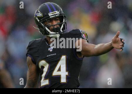 Baltimore Ravens cornerback Marcus Peters (24) reacts to the snap