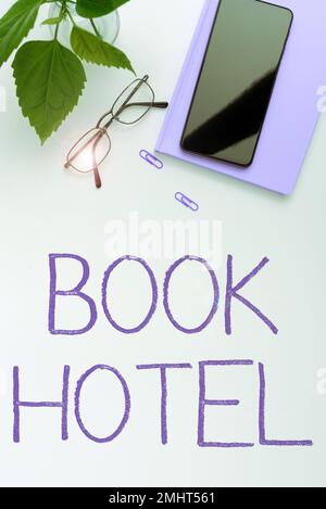 Affiche Book Hotel. Mot écrit sur un arrangement que vous faites pour avoir une chambre d'hôtel ou d'hébergement Banque D'Images