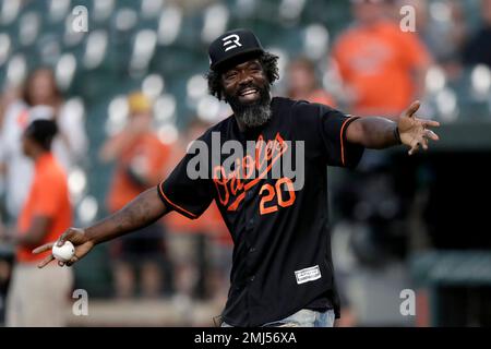 Pro Football Hall of Fame safety Ed Reed is introduced on the field prior to throwing out a ceremonial first pitch during a baseball game between the Baltimore Orioles and the Toronto Blue Jays, Tuesday, Sept. 17, 2019, in Baltimore. (AP Photo/Julio Cortez)