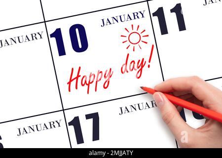 10th jour de janvier. Écrire le texte HAPPY DAY à la main et dessiner le soleil sur la date du calendrier 10 janvier. Enregistrez la date. Vacances. Motivation. Hiver m Banque D'Images