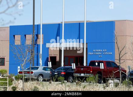 FILE - In this April 15, 2017, file photo, vehicles are parked outside the entrance to the GEO Group's immigrant detention facility in Aurora, Colo. U.S. immigration authorities say more than 2,200 people exposed to a mumps outbreak in at least two detention facilities have been quarantined. Immigration and Customs Enforcement said Tuesday, March 12, 2019, that the quarantine began March 7 at facilities in Pine Prairie, Louisiana, and Aurora, Colorado. (AP Photo/David Zalubowski, File)