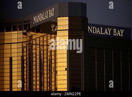 FILE - In this Oct. 3, 2017, file photo, windows are broken at the Mandalay Bay resort and casino in Las Vegas, the room from where Stephen Craig Paddock fired on a nearby music festival, killed 58 and injuring hundreds on Oct. 1, 2017. Attorneys in a negligence lawsuit stemming from the Las Vegas Strip shooting say the massacre could have been avoided if a hotel tightened security after a man was found with multiple weapons at the Mandalay Bay resort in 2014. Lawyer Robert Eglet said Friday, July 6, 2018, that the arrest of Kye Aaron Dunbar in a 24th-floor hotel room with guns including an as