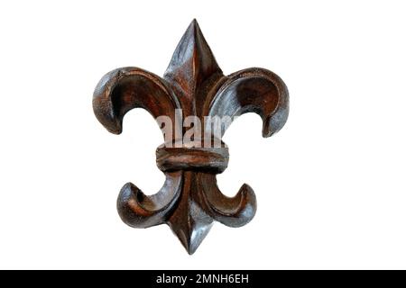 Gros plan de la décoration murale fleur de lis en bois Banque D'Images