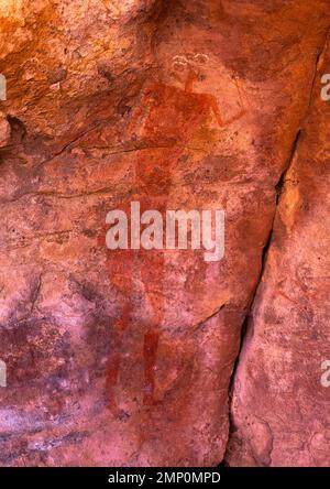 Peinture rock représentant une femme, Parc national de Tassili n'Ajjer, Tadrar Rouge, Algérie Banque D'Images